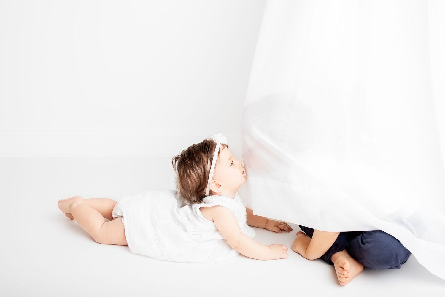 baby photo all white background siblings playing