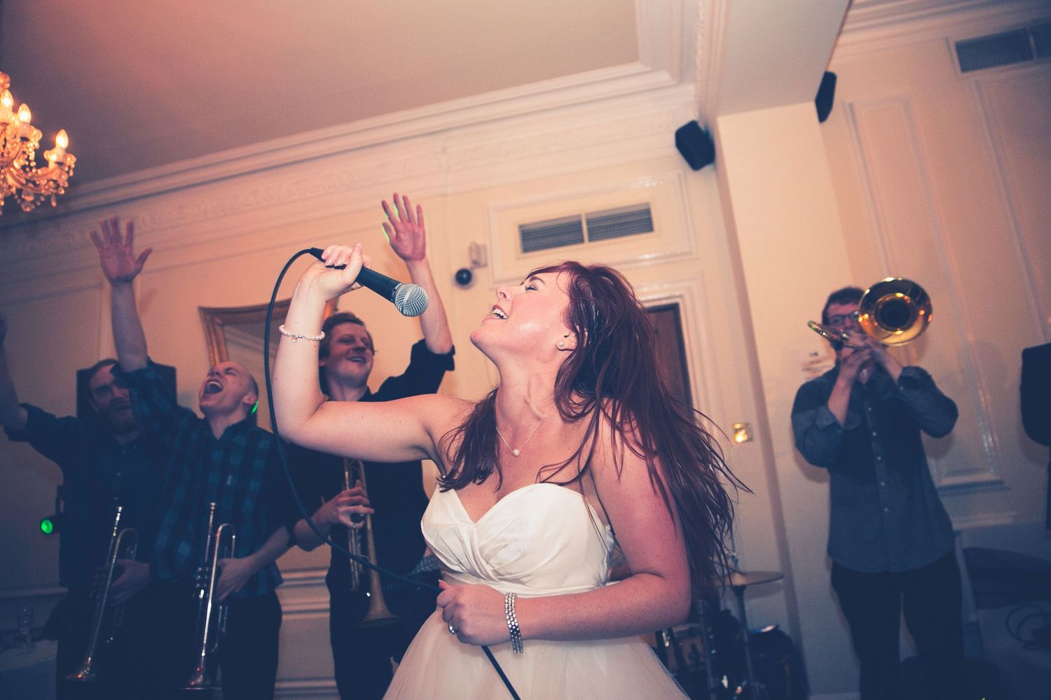 Bride singing at wedding party at West Tower, Liverpool, Merseyside