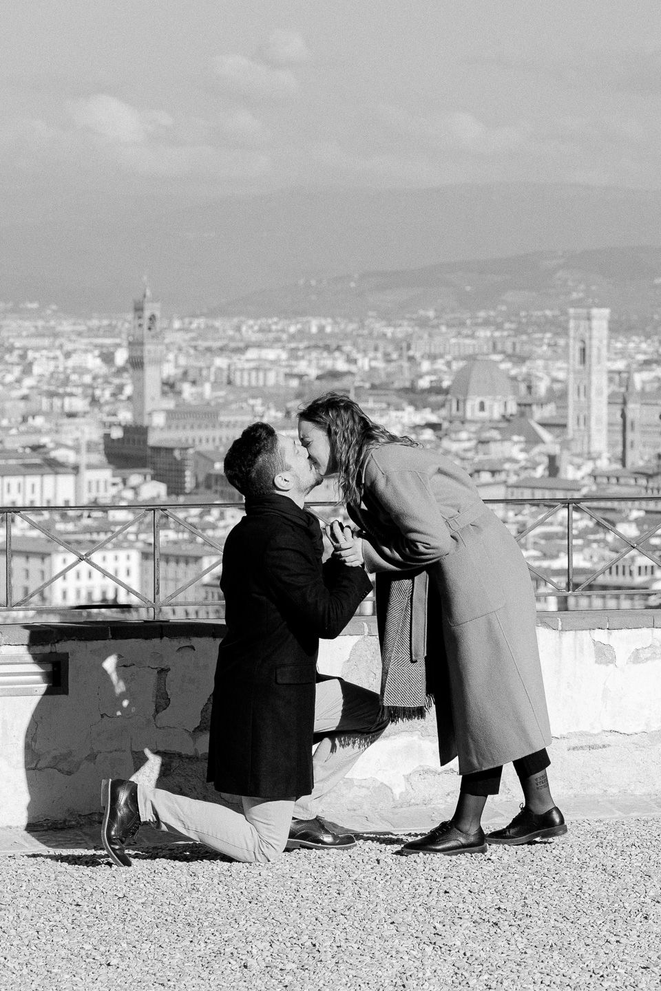 man proposing to a woman with Florence view