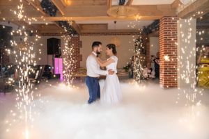 Wedding dance floor with sparkler effects and atmospheric lighting.