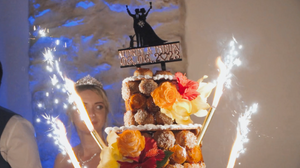 Wedding cake with sparklers creating a magical display at a reception celebration.