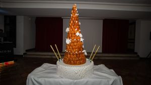 Ornate golden wedding cake displayed at reception venue.