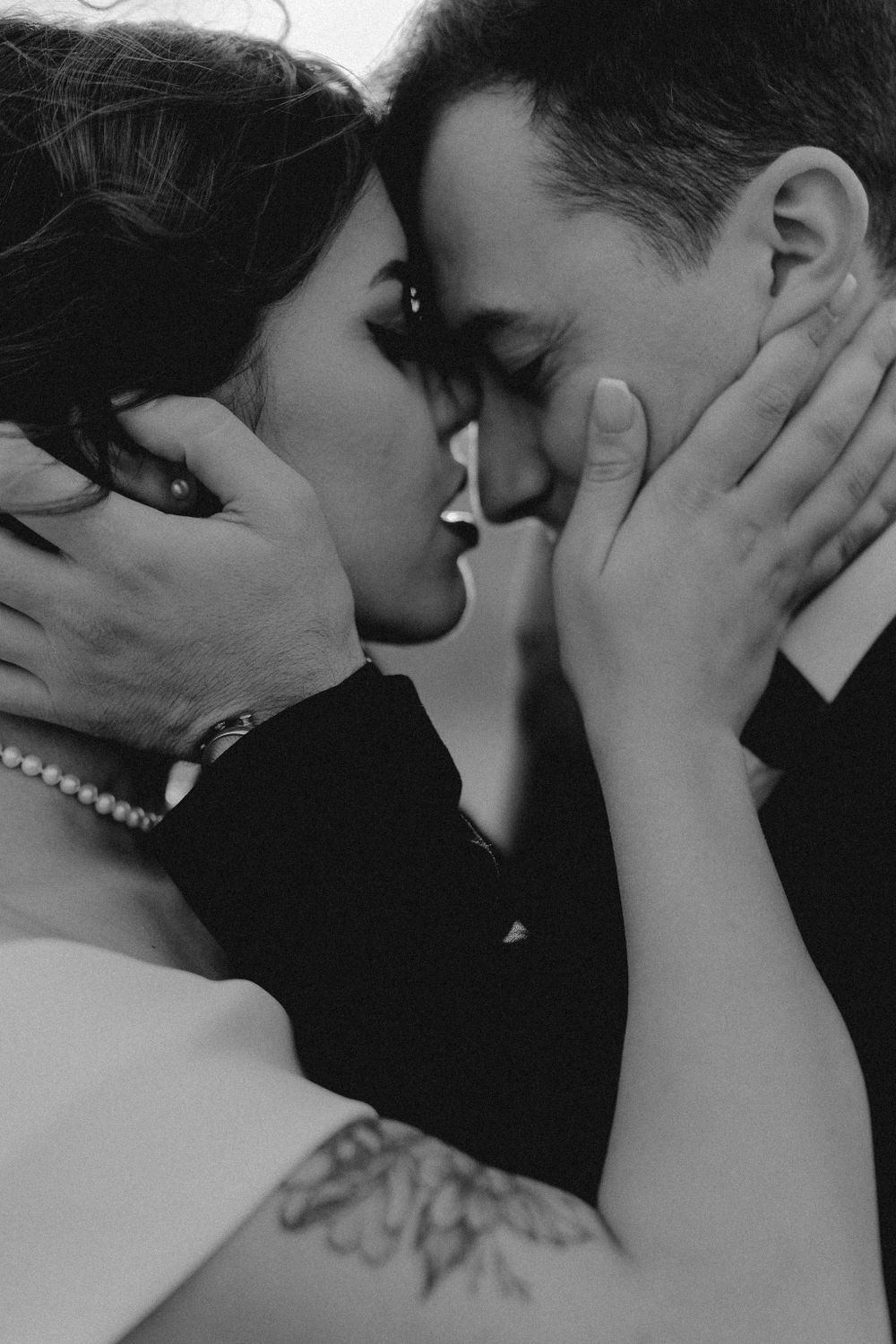Black and white intimate wedding portrait series showing tender moments and emotions.