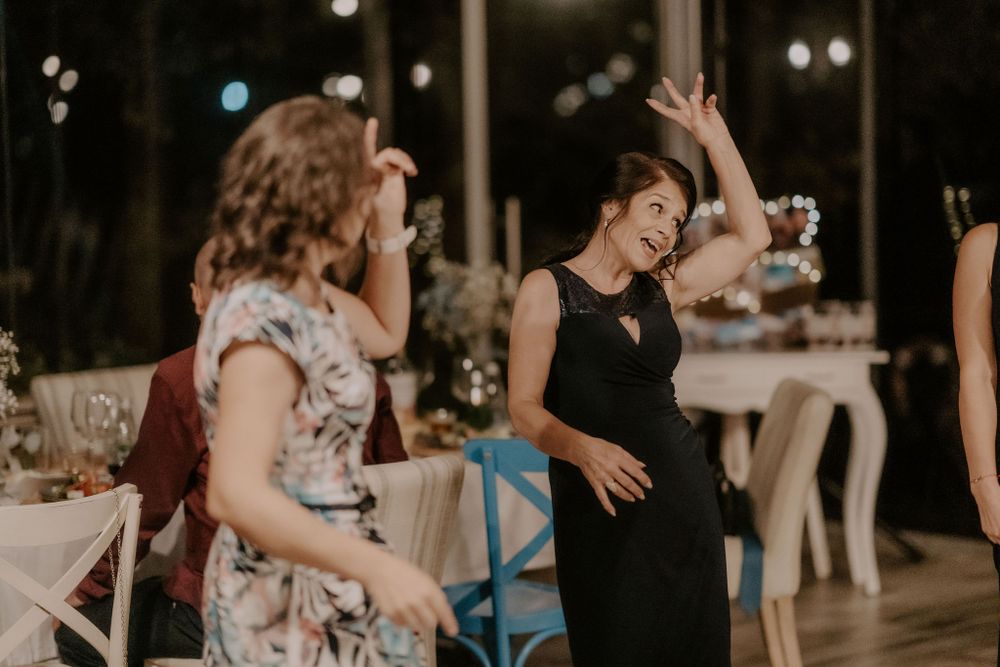 Wedding guests enjoying themselves dancing at the reception.
