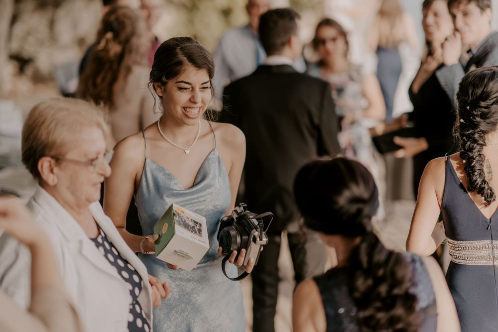 Wedding guests gathered outdoors for a celebration.