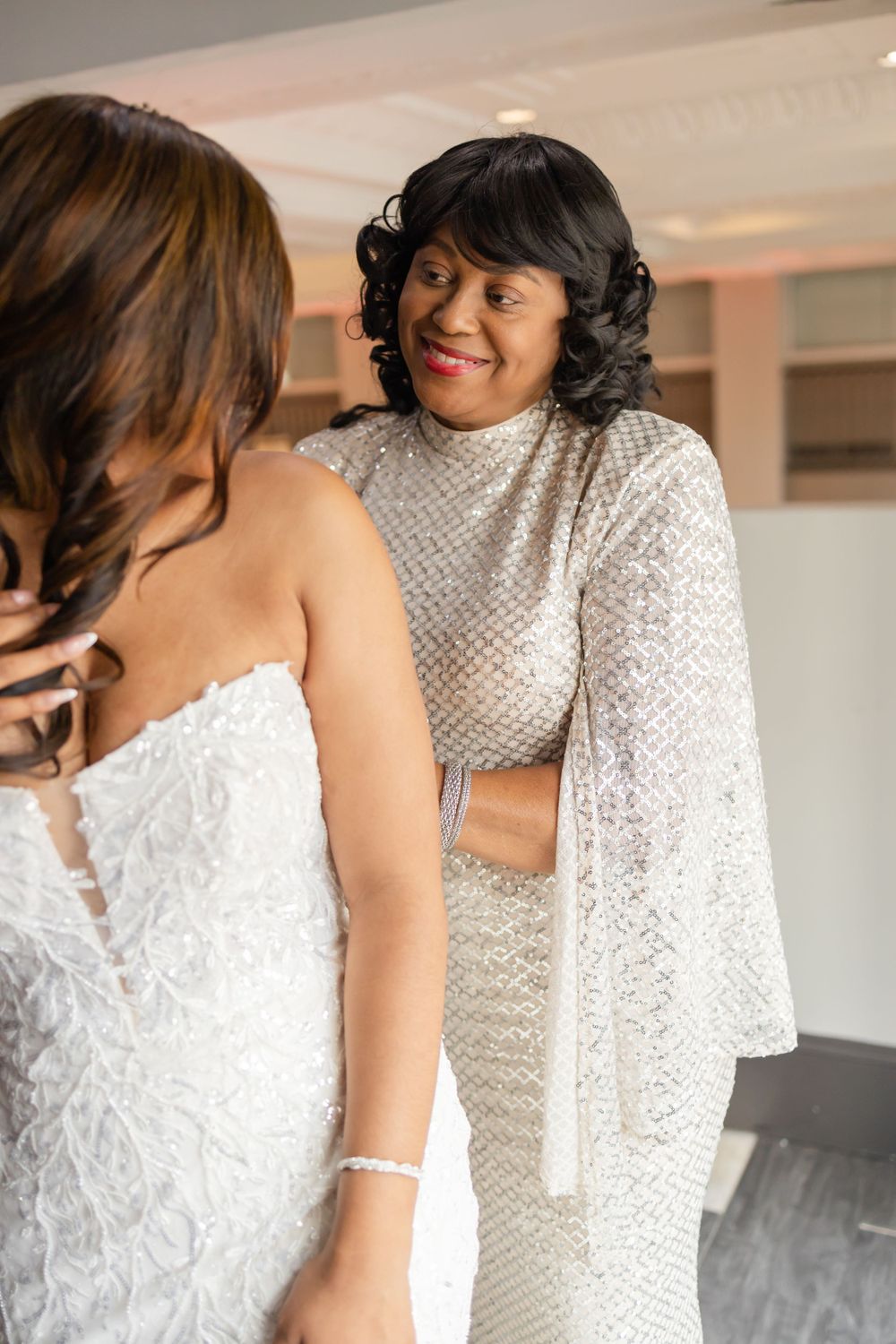 Emotional moment shared during wedding day preparations.