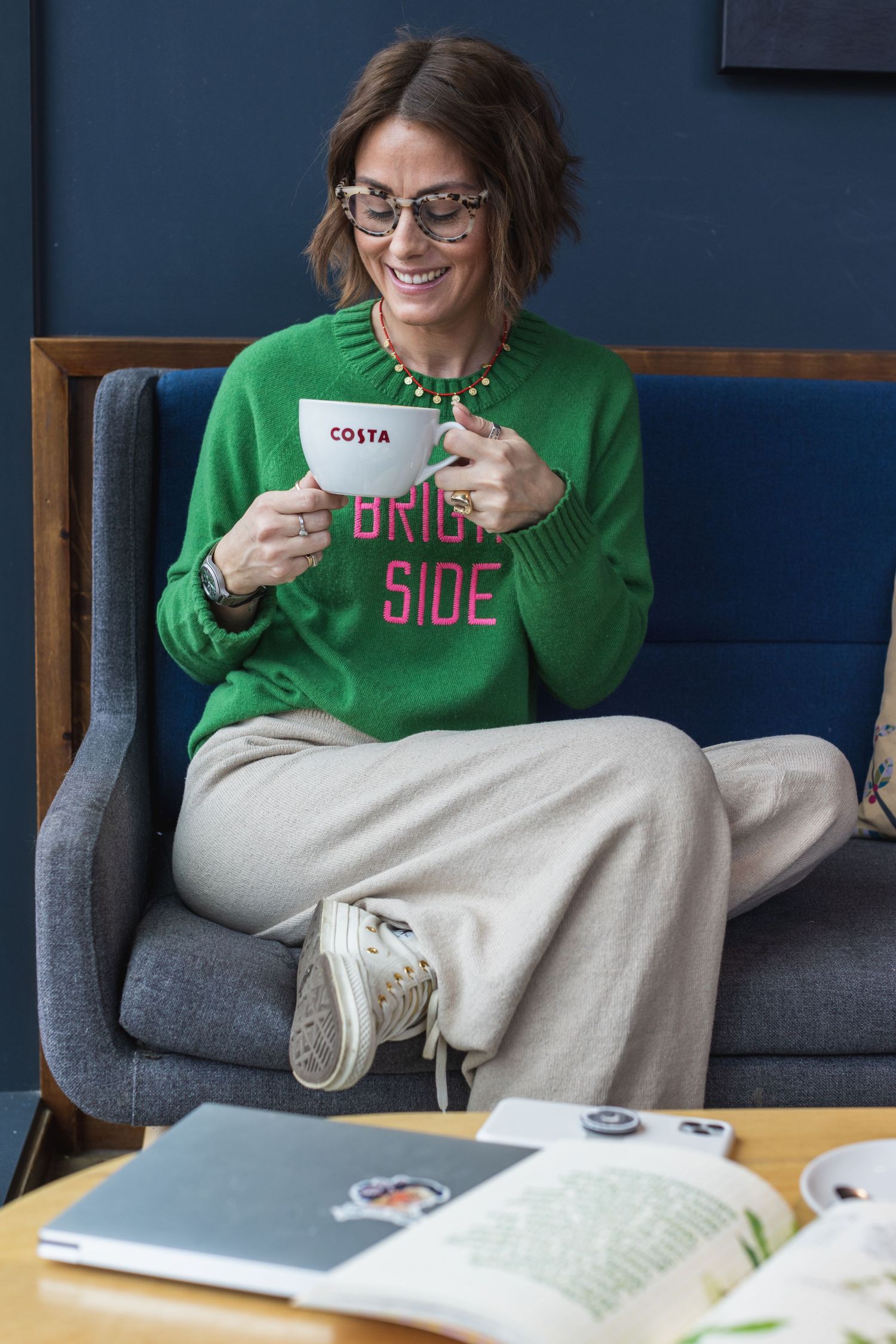 Influencer model sat in costa enjoying a coffee as part of an influencer marketing ad campaign for instagram in Brighton