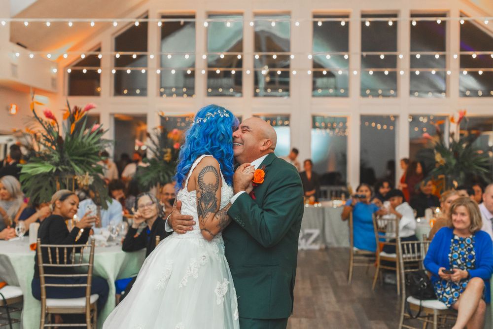 wedding photo of father daughter dance under twinkle lights at Celebration at the Bay