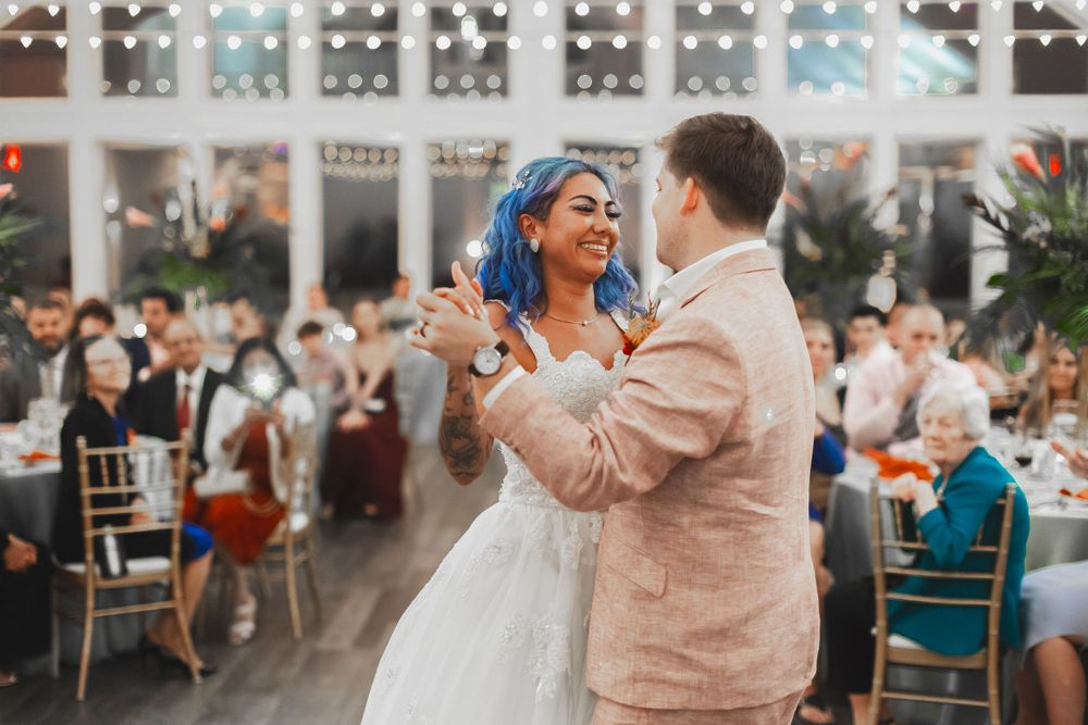 wedding photos first dance under twinkle lights at Celebration at the Bay