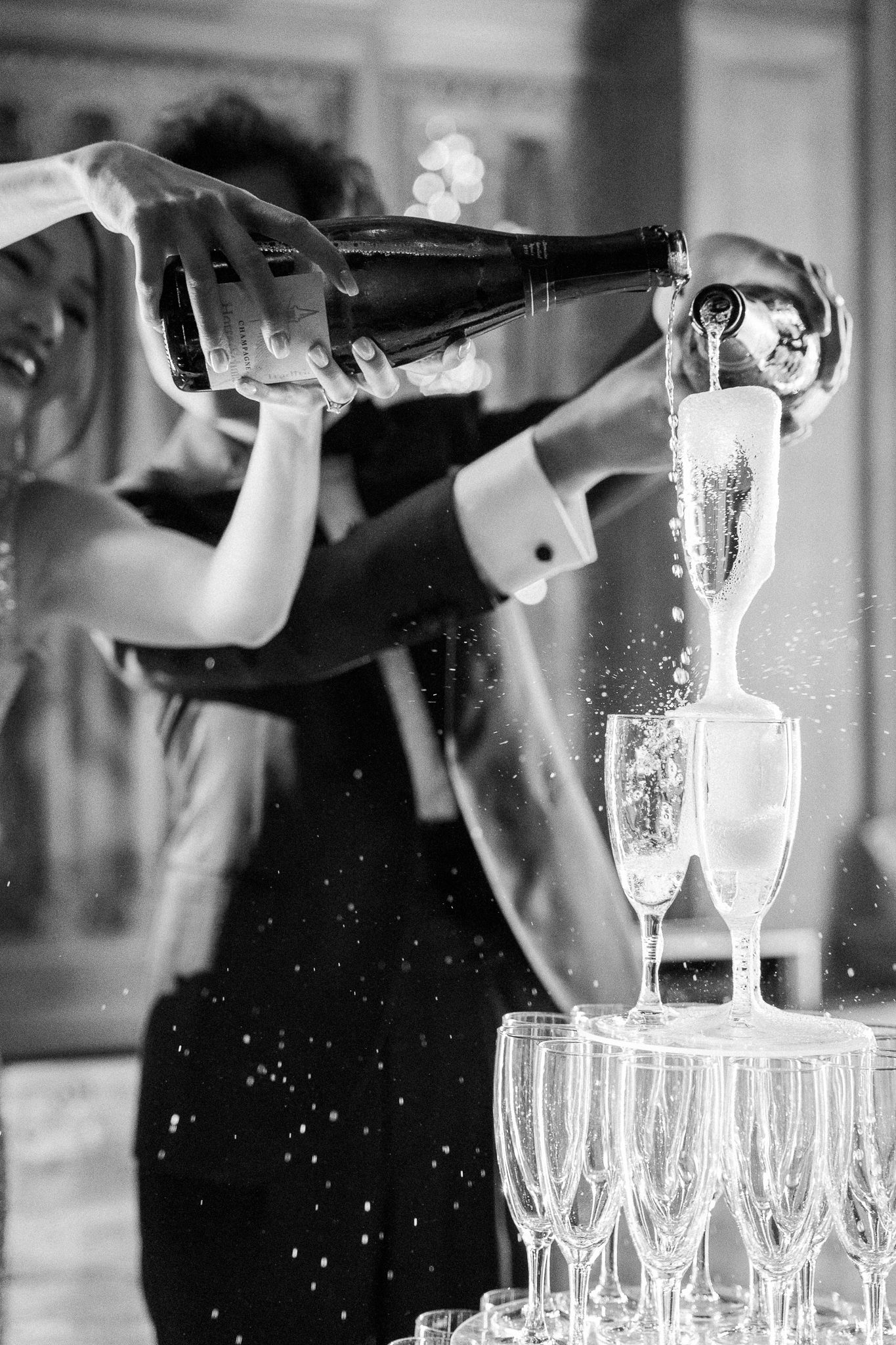 A series of black and white photos showing champagne being poured into glasses with dramatic splashing effects.