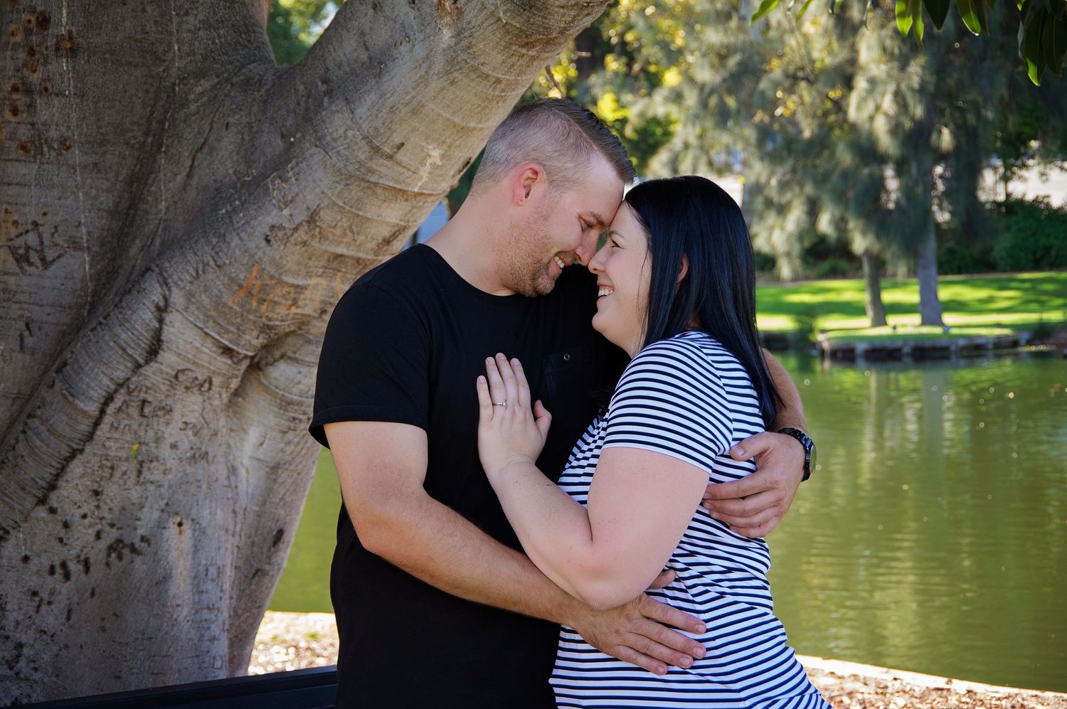 couple close embracing and smiling at eachother