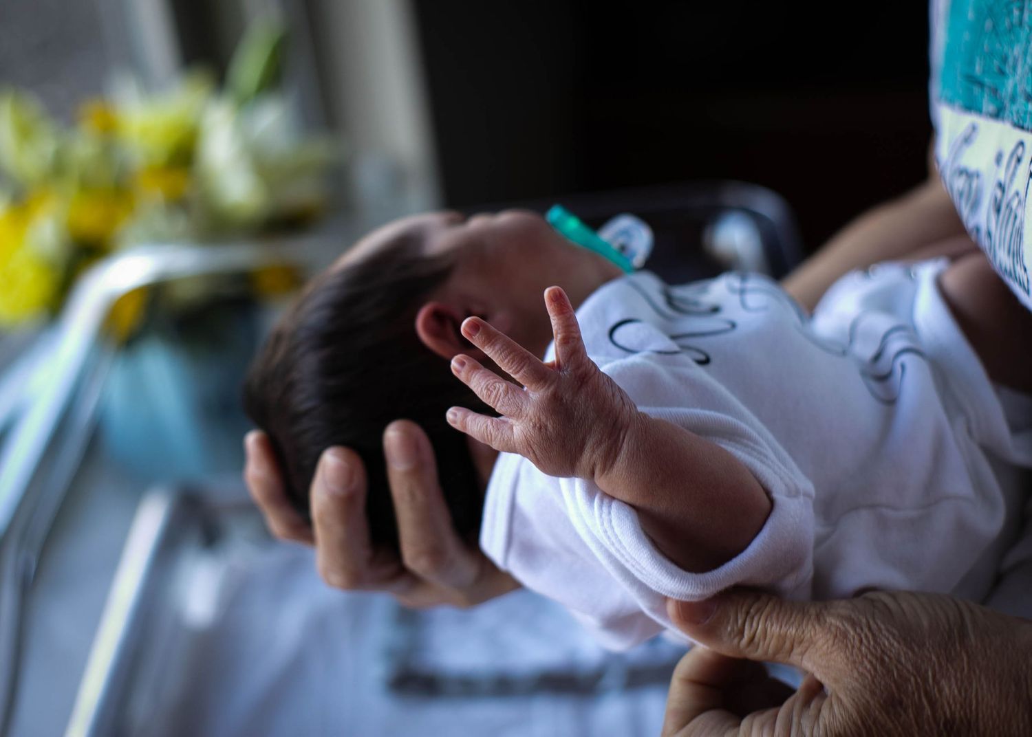 Newborn held by his mother in the hospital the day after he was born at UnityPoint Health in Sioux City, IA.