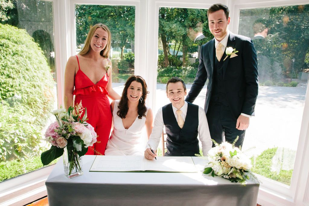 Bride and Groom and Witnesses signing the register