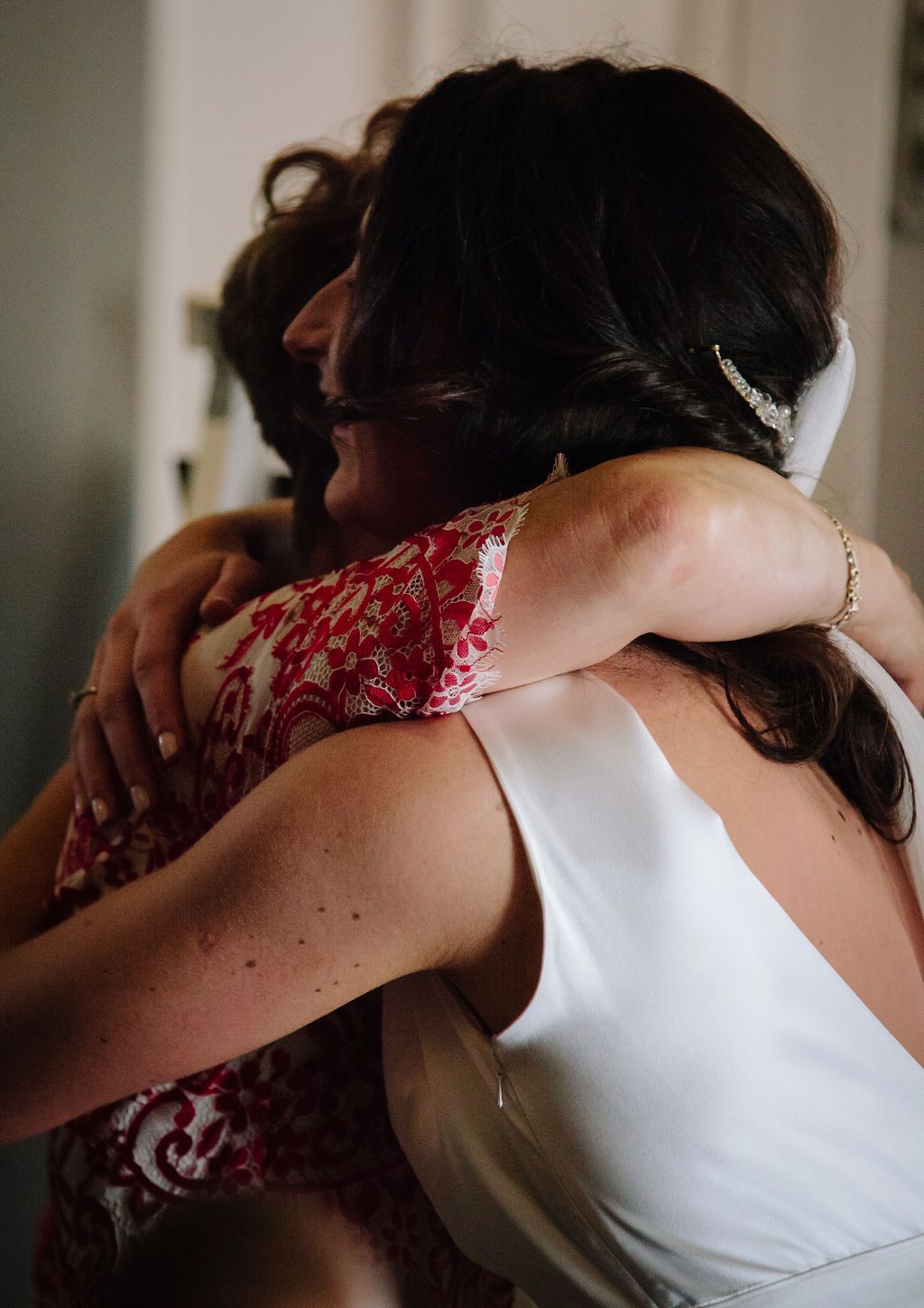 Bride hugging mother in law