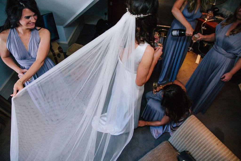 Bride and her bridesmaids getting ready