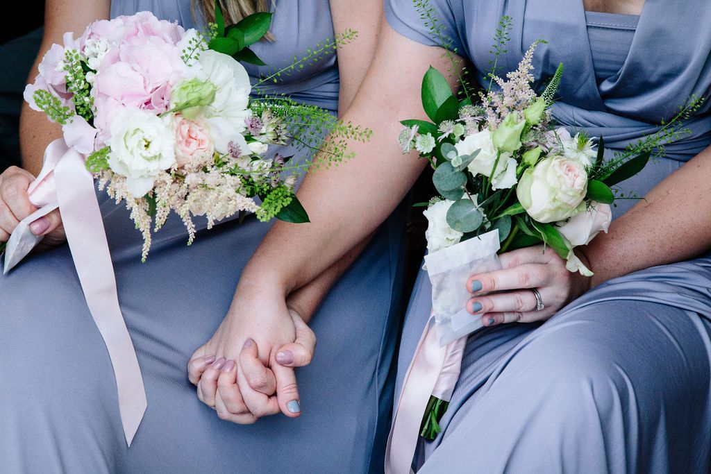 bridesmaids holding hands