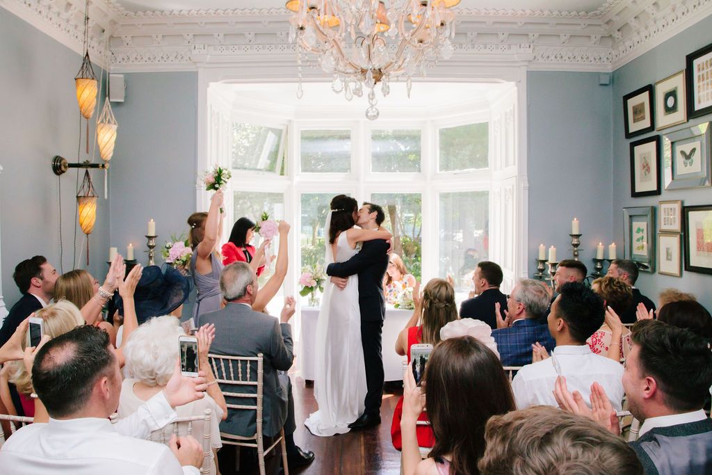 Bride and Groom hug after been announced husband and wife at Didsbury House Hotel