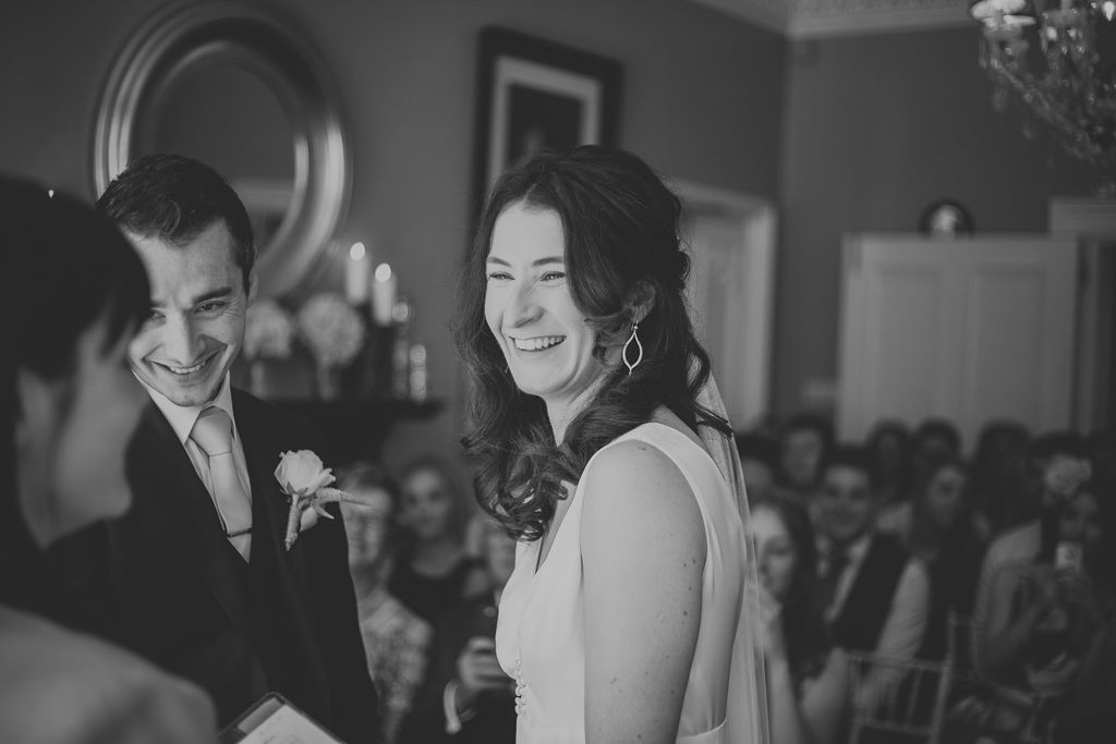 Bride laughing whilst getting married