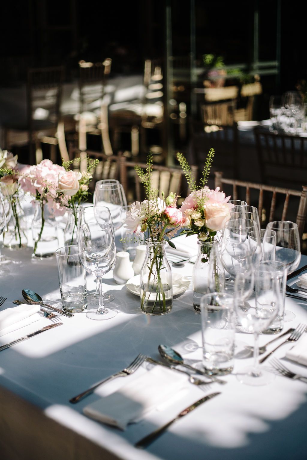 Gorgeous sunlight on wedding party table settings