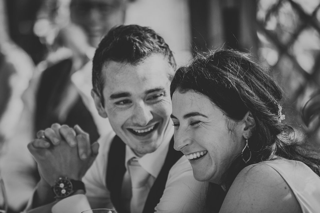 Black and White of bride and groom laughing