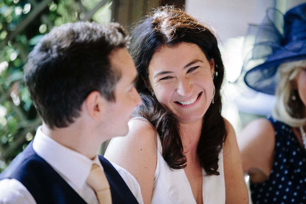 Bride looking lovingly and smiling at her new husband
