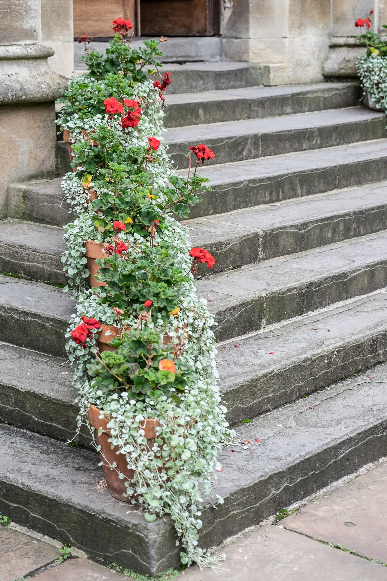exeter college Oxford university steps with cascading flowers for wedding