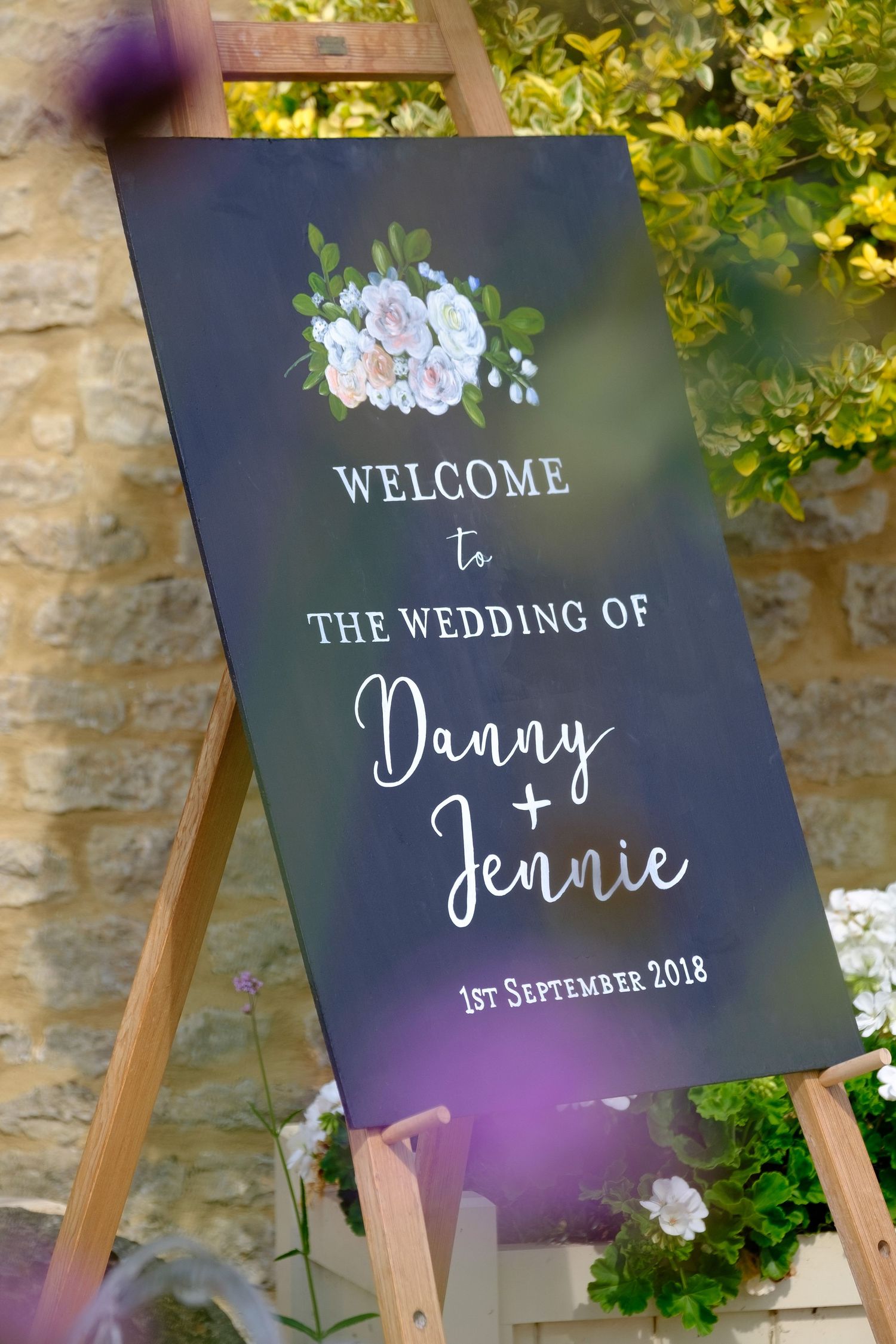 wedding handpainted sign chalkboard welcoming guests to wedding barn venue in Oxfordshire