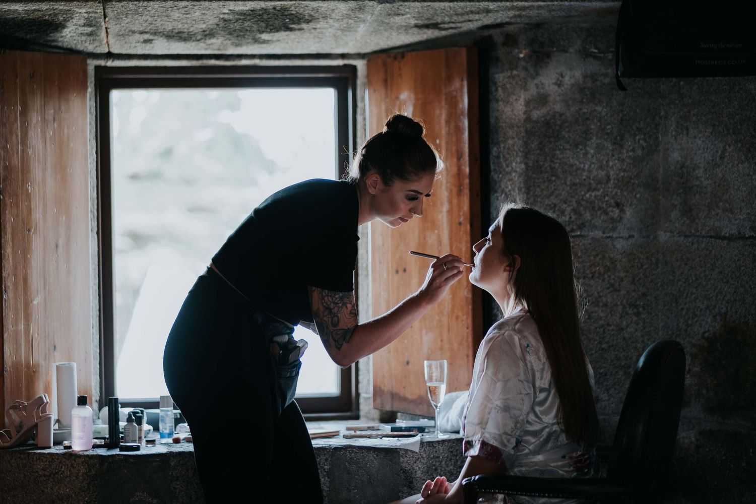 bride having her makeup done