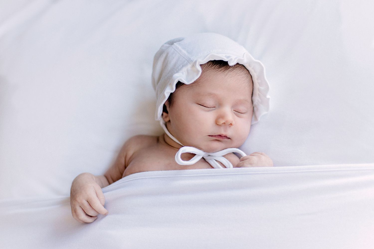 newborn with bonnet