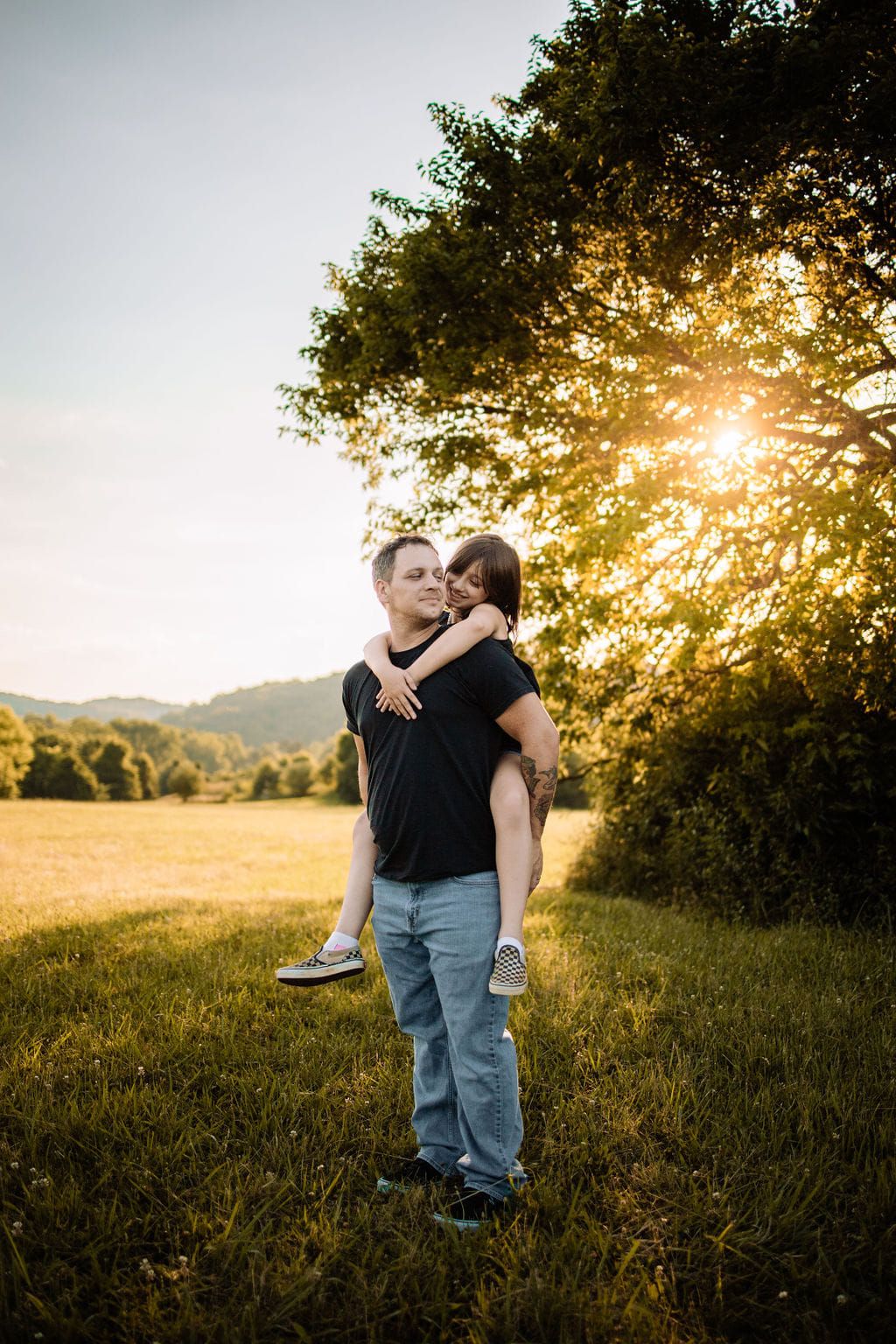 A special moment between father and daughter at their family maternity session in Oak Ridge, TN.
