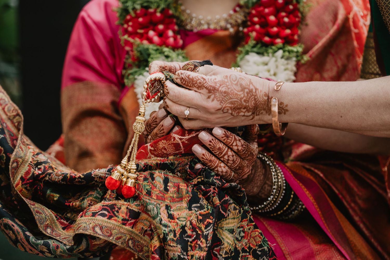 Henna is on the hands of mother of the bride at Indian Ceremony