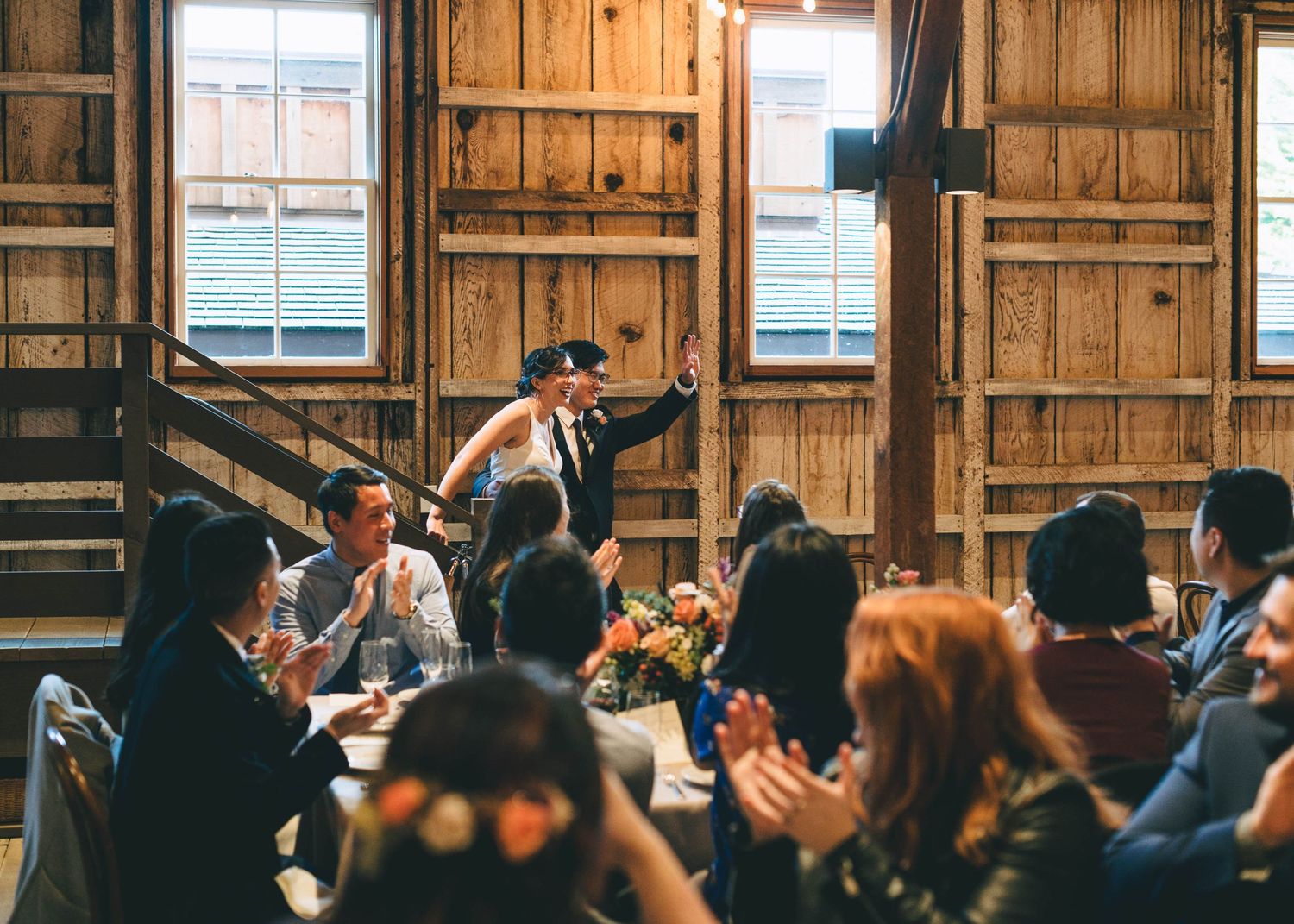bride and groom making their grand entrance in the barn at cooper molera in Monterey
