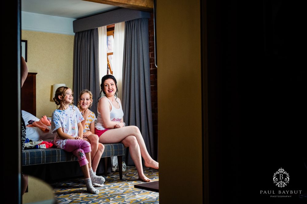 Getting ready scene in hotel room with natural window light.