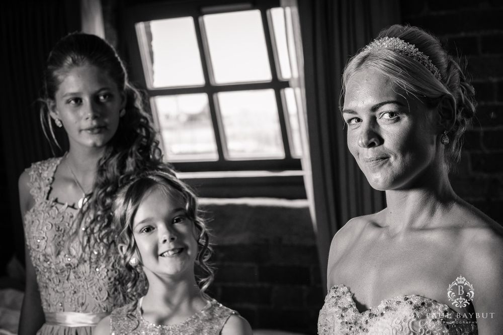 Black and white portrait featuring elegant formal wear and intricate lace details.