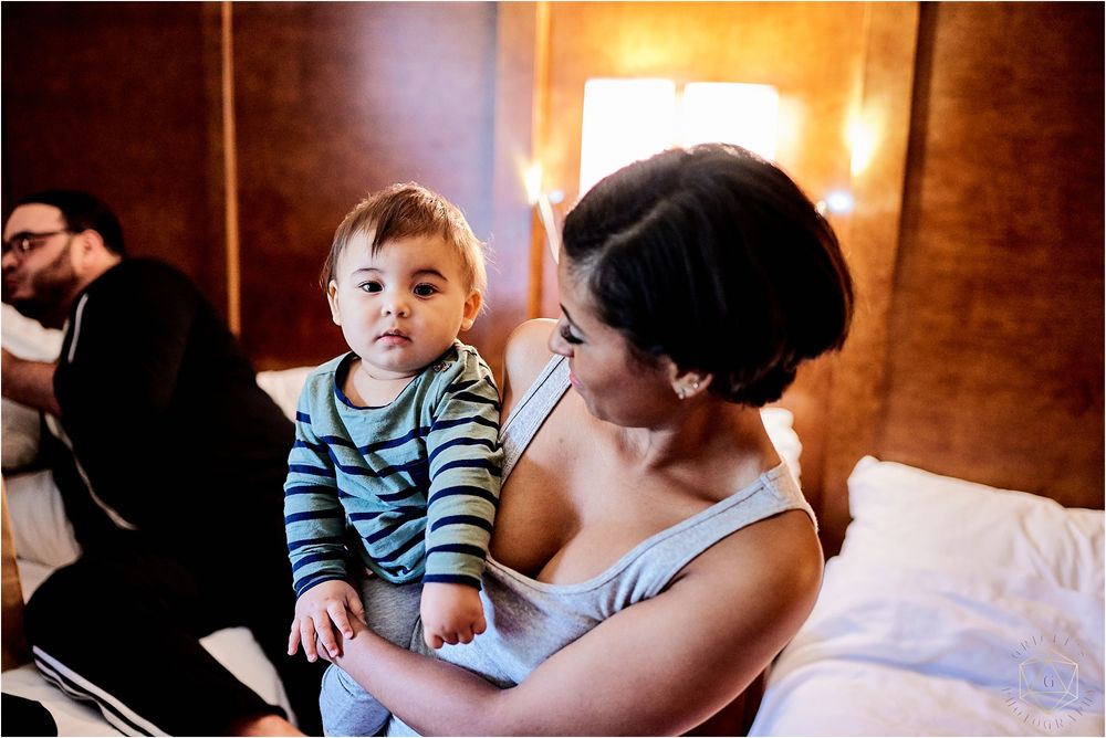 Candid moment showing relaxed indoor scene with striped clothing.