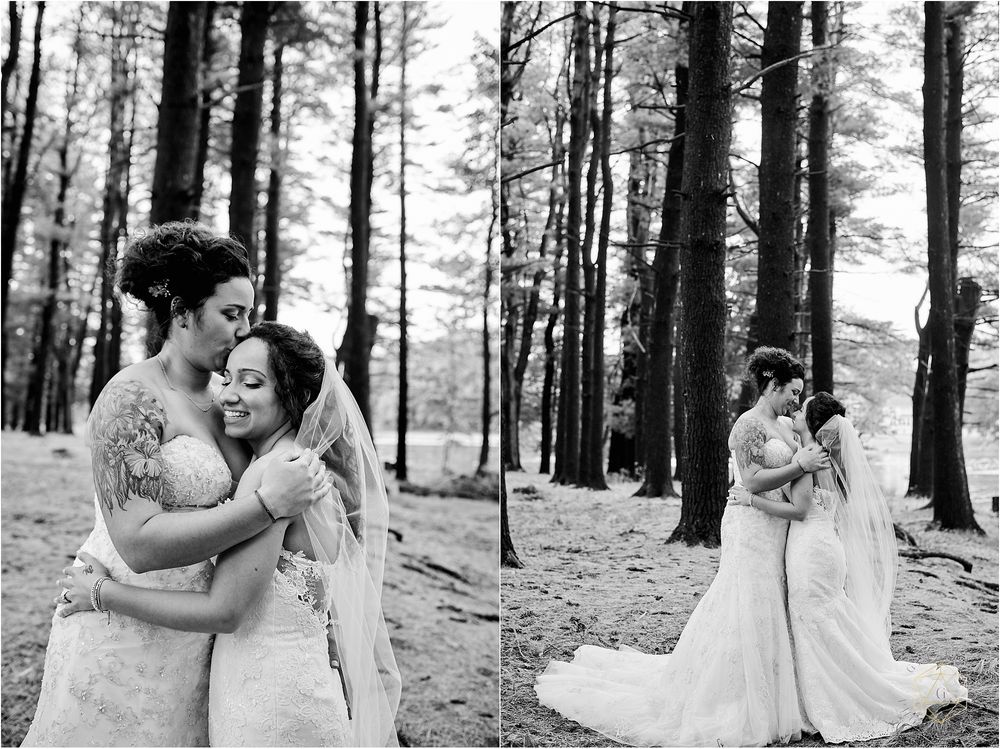 Black and white wedding photos showing tender embraces between two brides in a forest setting.