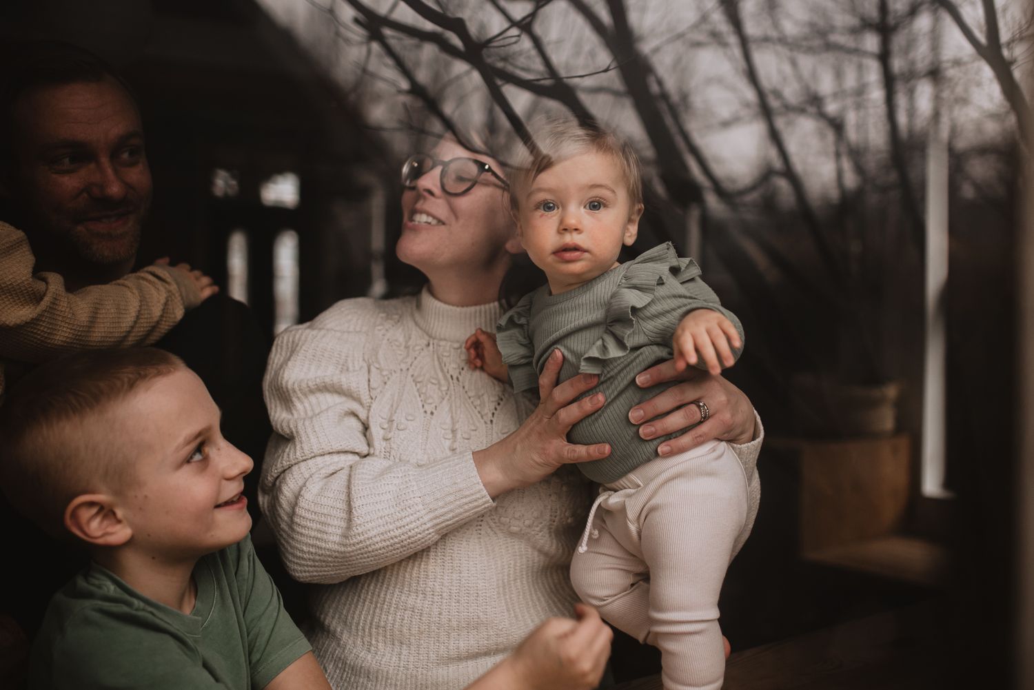 An intimate family moment captured in warm tones during golden hour.
