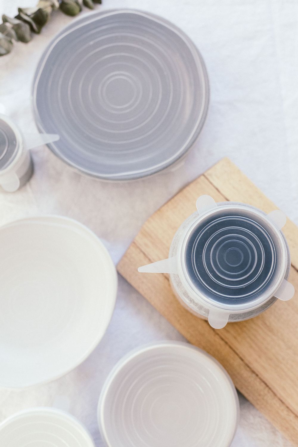 Overhead view of modern ceramic plates and cups with concentric circle patterns.