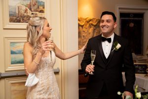 Newlyweds share a joyful moment with champagne during their wedding reception.