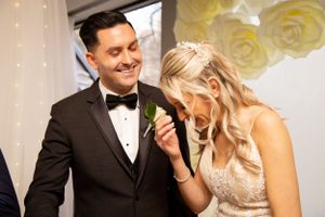 Elegant wedding reception features romantic moments under sparkling lights and floral decor.
