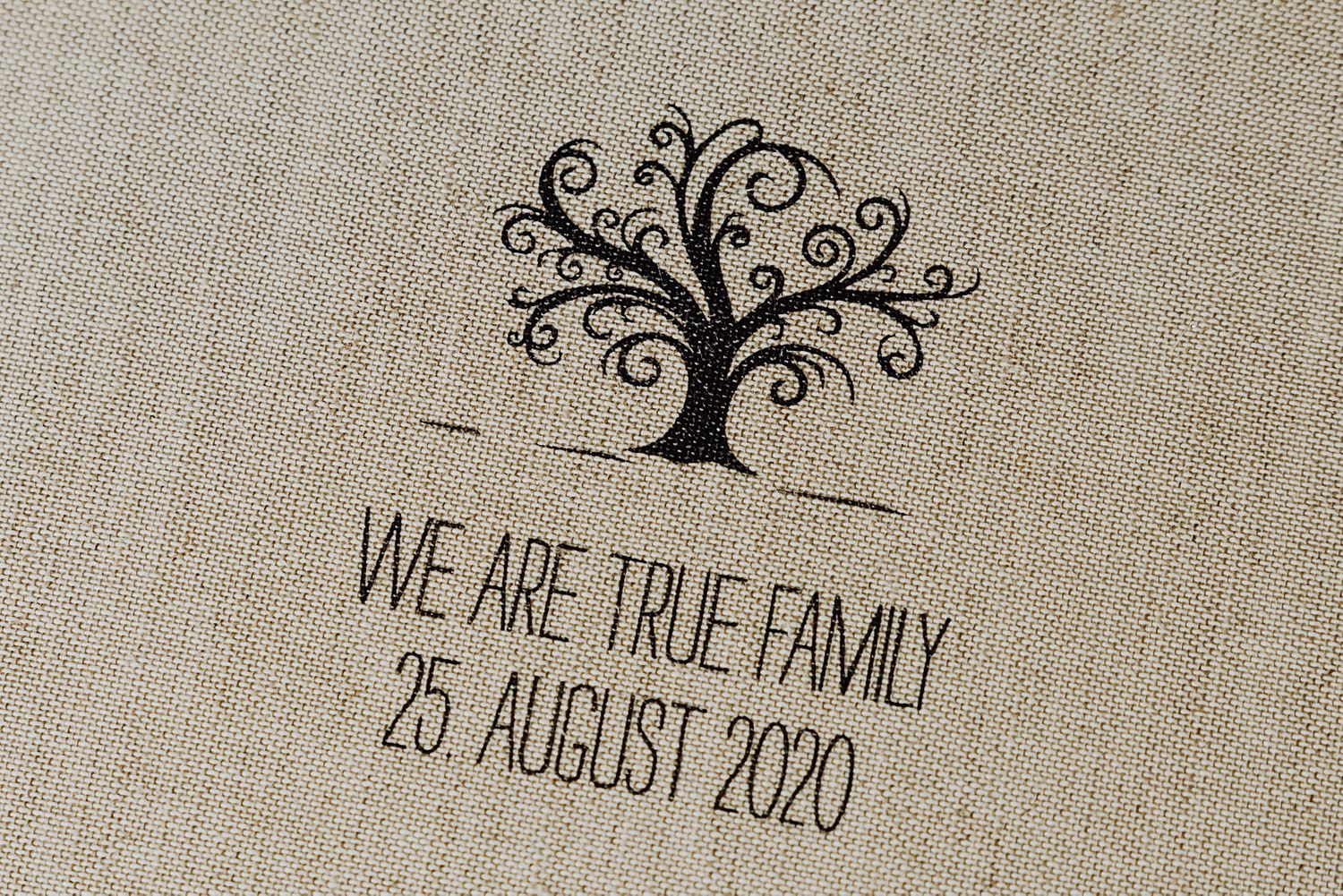 Tree of life design with text 'WE ARE TRUE FAMILY 25. AUGUST 2020' embroidered on linen fabric.