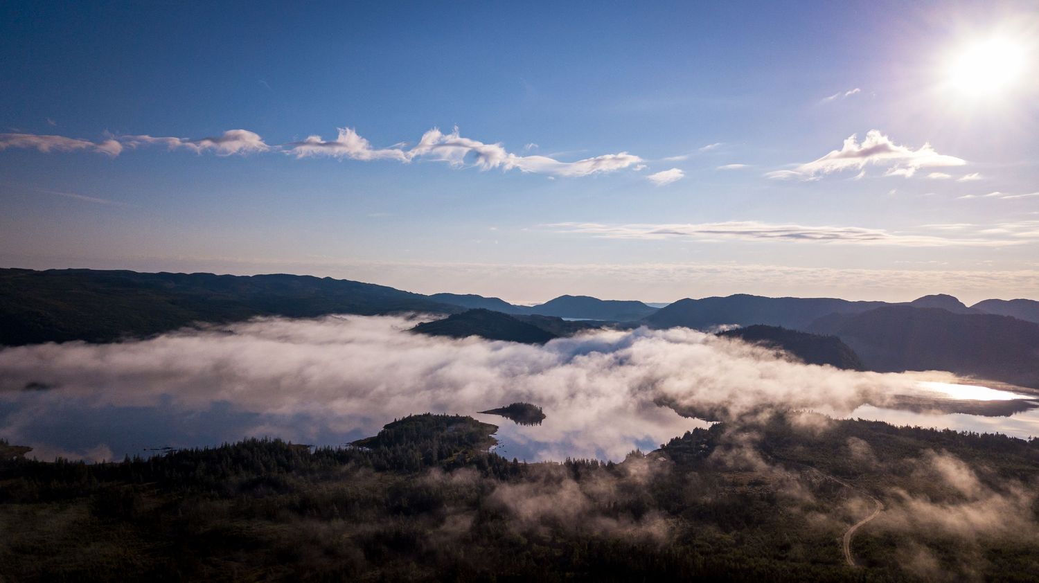 Aerial photo of foggy mist over a lake in the backcountry of Western Newfoundland