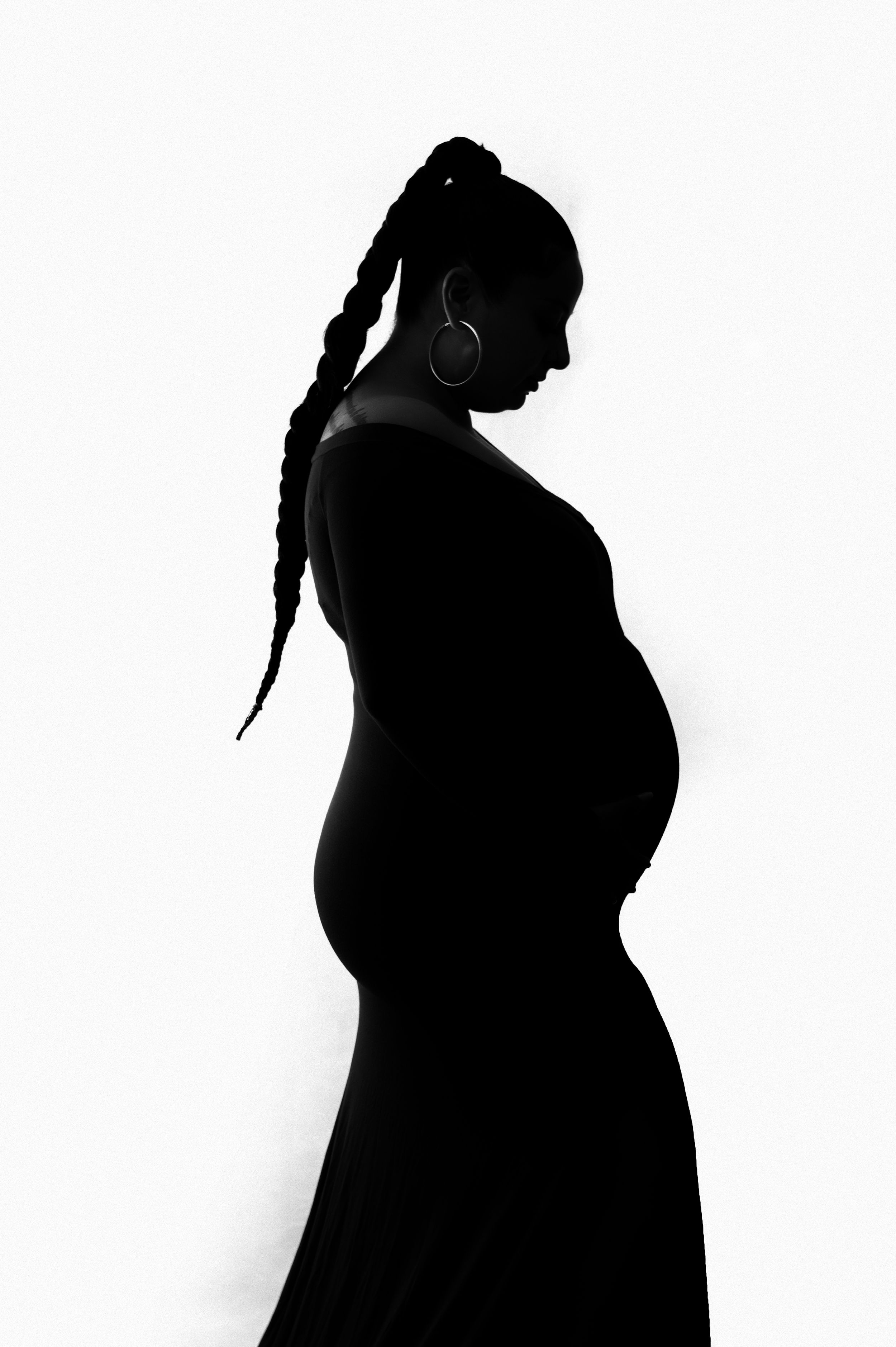 Artistic silhouette series of a pregnant woman's profile against white background.