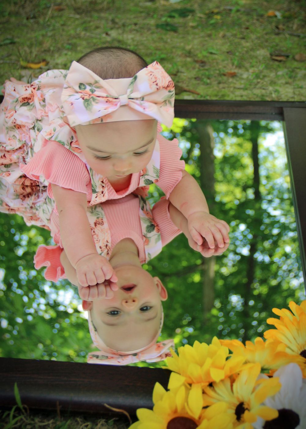 Creative mirror reflection photo with sunflowers and floral headband.