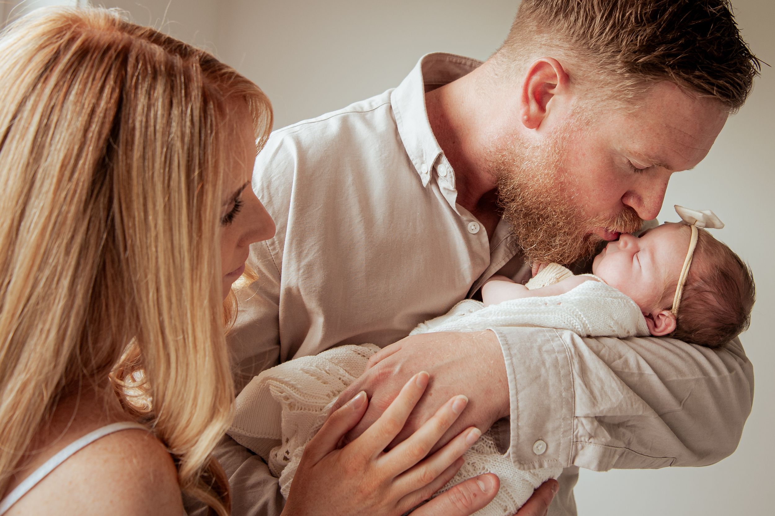 A tender moment showing gentle interaction with a sleeping infant in white.
Altona Family Photographer Melbourne