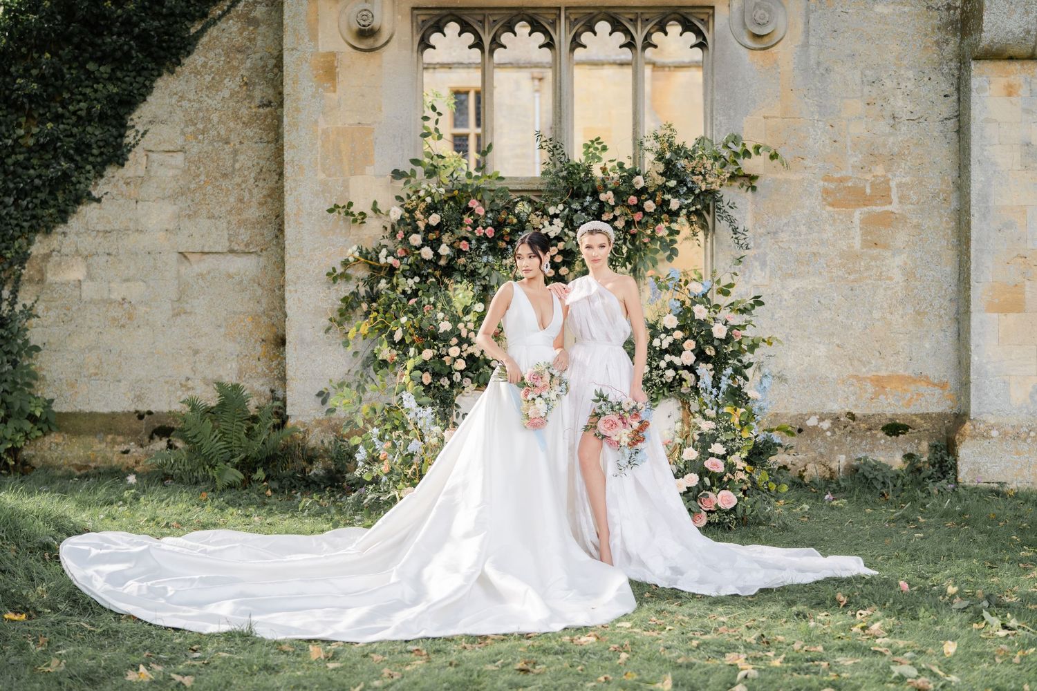 A bridal portrait against historic stone walls and gothic windows with climbing roses.