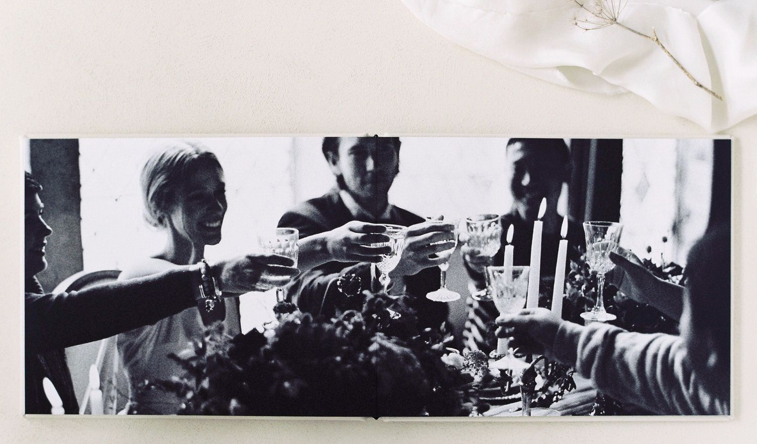 Black and white wedding reception photo from a Melbourne wedding displayed across a full album spread.