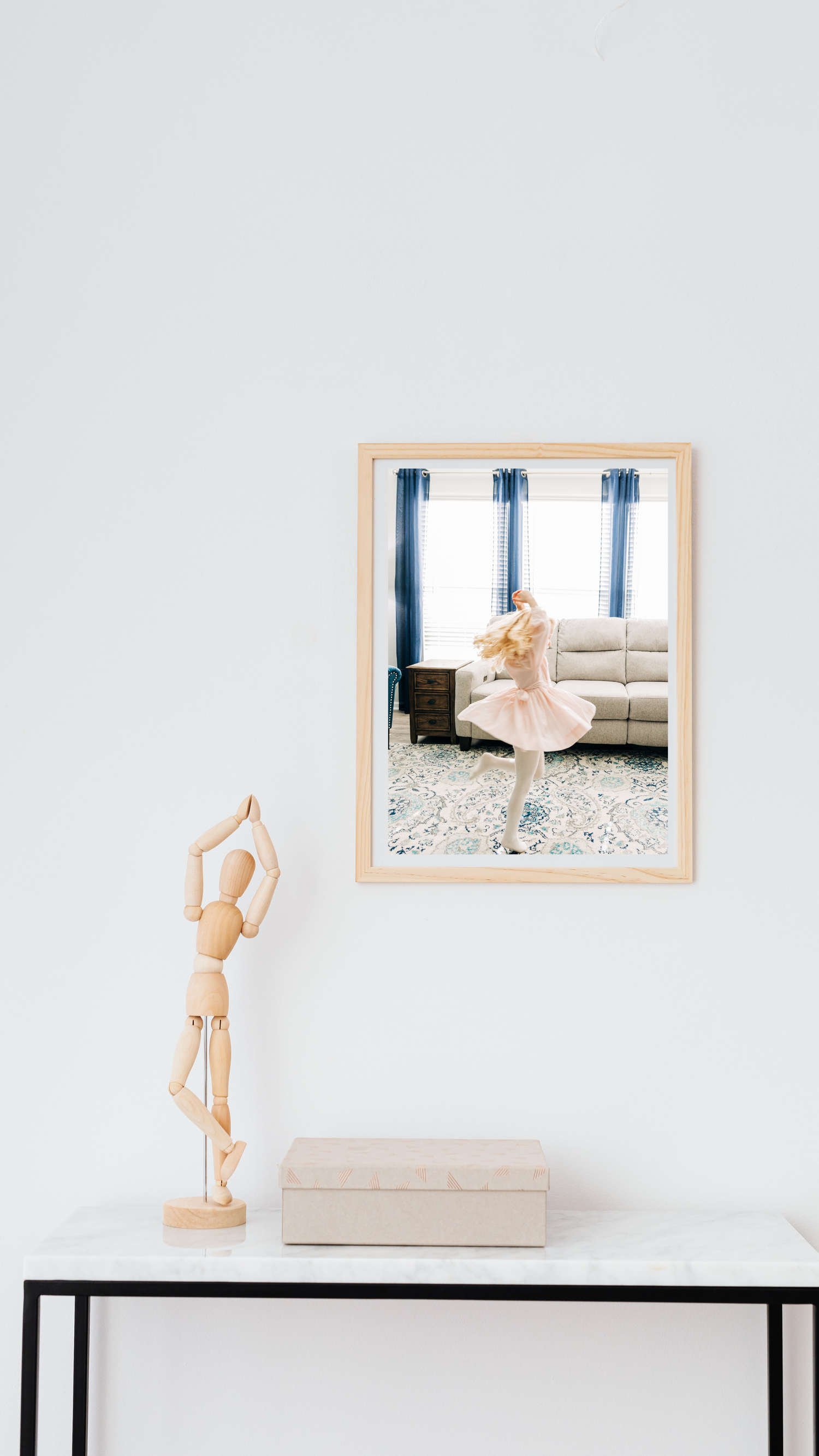 a little girl dancing in a framed photo