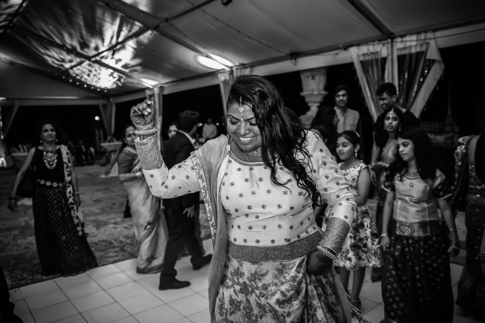 Indian bride dancing at wedding