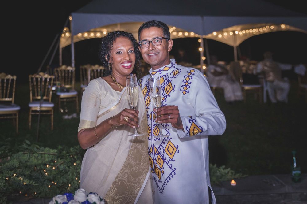 Married couple standing together toasting